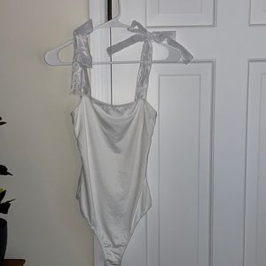 White one piece with bows